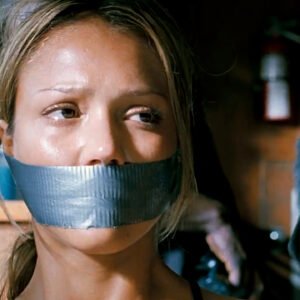 Jessica Alba in Into the Blue hands handcuffed behind her back and tape gagged