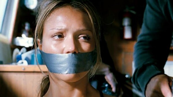 Jessica Alba in Into the Blue hands handcuffed behind her back and tape gagged