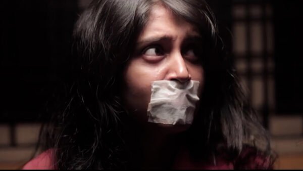 A woman kidnapped chair tied and tape gagged in SHE short film - thumbnail