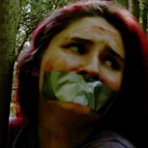 Woman tied to a tree and tape gagged in the woods in Nightmare Obsessed short film - thumbnail