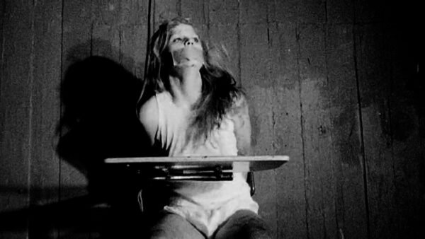 Women chair tied handcuffed and tape gagged in Bau Brut short film - thumbnail