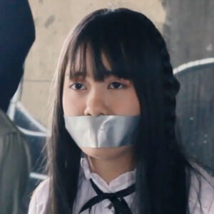 Girl in school uniform bound and tape gagged in คนเดือดบ้าระห่ำ short film - thumbnail