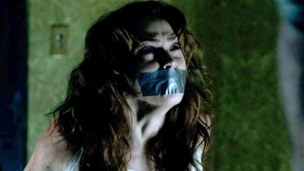 Fiona Dourif kidnapped chair tied and tape gagged in Curse of Chucky - thumbnail